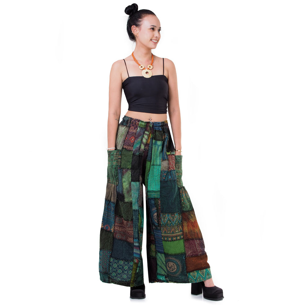 Full front shot of green boho patchwork wide-leg hippie palazzo pants for women and men.