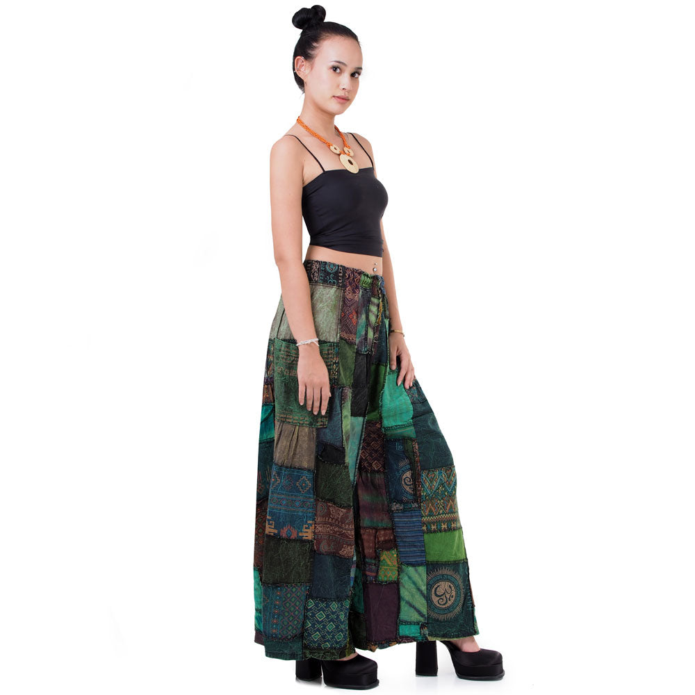 Side profile of green wide-leg boho patchwork palazzo pants showing the comfortable fit.