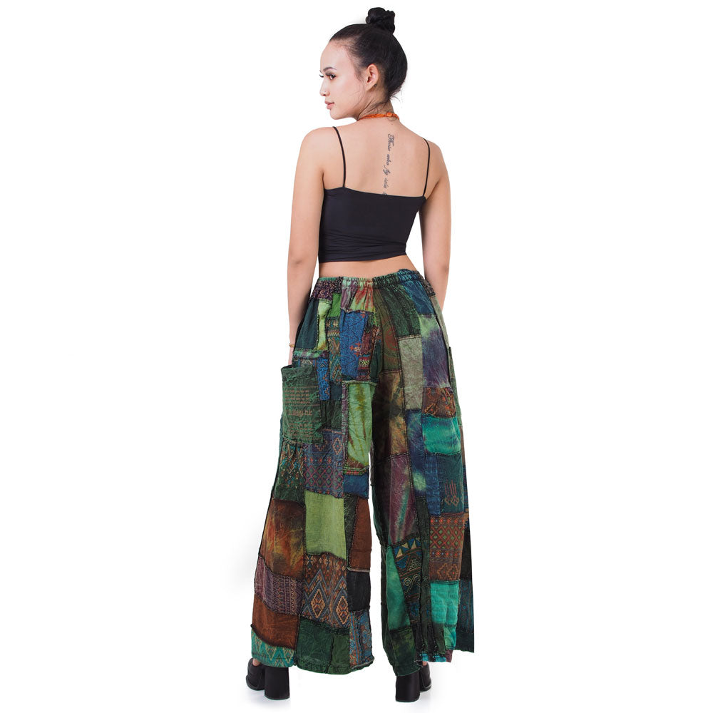 Rear view of green boho patchwork wide-leg palazzo pants showcasing the elastic waist and wide leg.