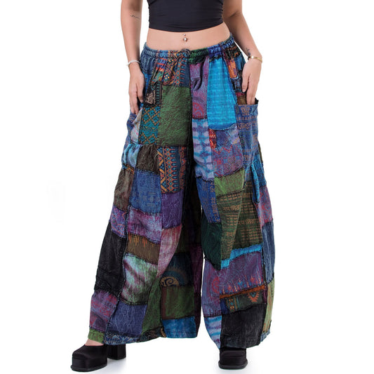 Close-up of purple boho patchwork wide-leg palazzo pants focusing on the vibrant purple tones and patchwork art.