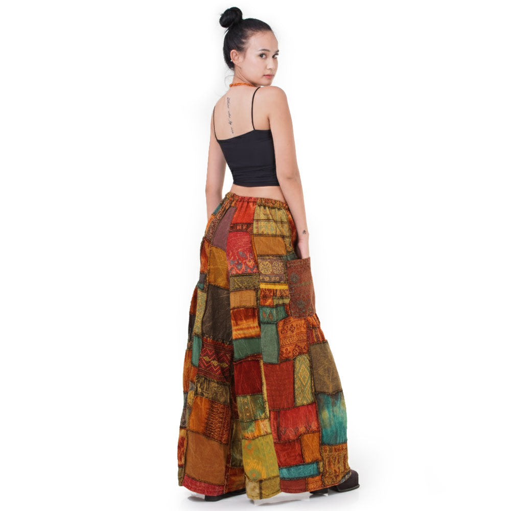 Back view of the vibrant patchwork Hippie Palazzo Pants (Thai Harem Yoga) worn with a simple black top.
