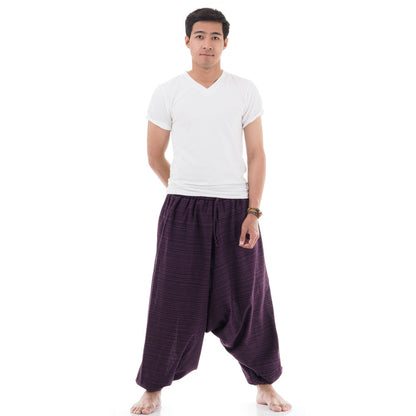 Side view of male model in purple pinstripe drop crotch Thai harem pants with white shirt