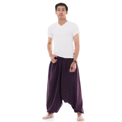Male Model wearing purple pinstripe drop crotch Thai harem pants with white shirt, front view