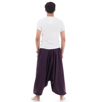 Back view of purple men pinstripe drop crotch Thai harem pants worn with white shirt