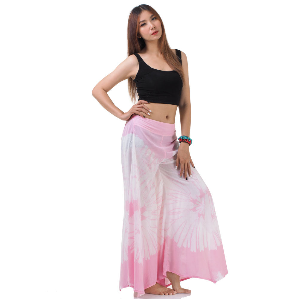 Side view of the Blushing Rose Hippie Tie Dye Palazzo Pants on a female model, emphasizing the comfortable and loose leg fit.