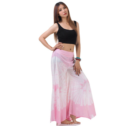 Side view of the Blushing Rose Hippie Tie Dye Palazzo Pants on a female model, emphasizing the comfortable and loose leg fit.
