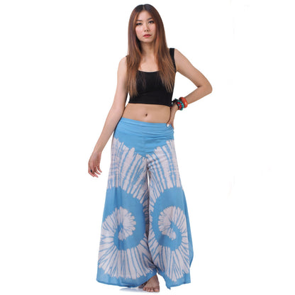 Side view of the Royal Blue Hippie Tie Dye Palazzo Pants on a female model, showing the generous flare and effortless silhouette.