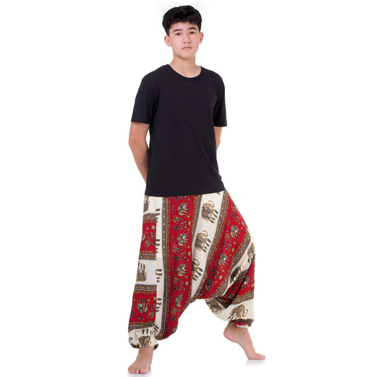 Male model in red boho festival harem pants, handcrafted in Thailand, fits S-L.