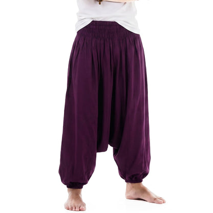 Detailed macro view of the purple Men's drop crotch harem pants, featuring vibrant and rich bamboo rayon tones.