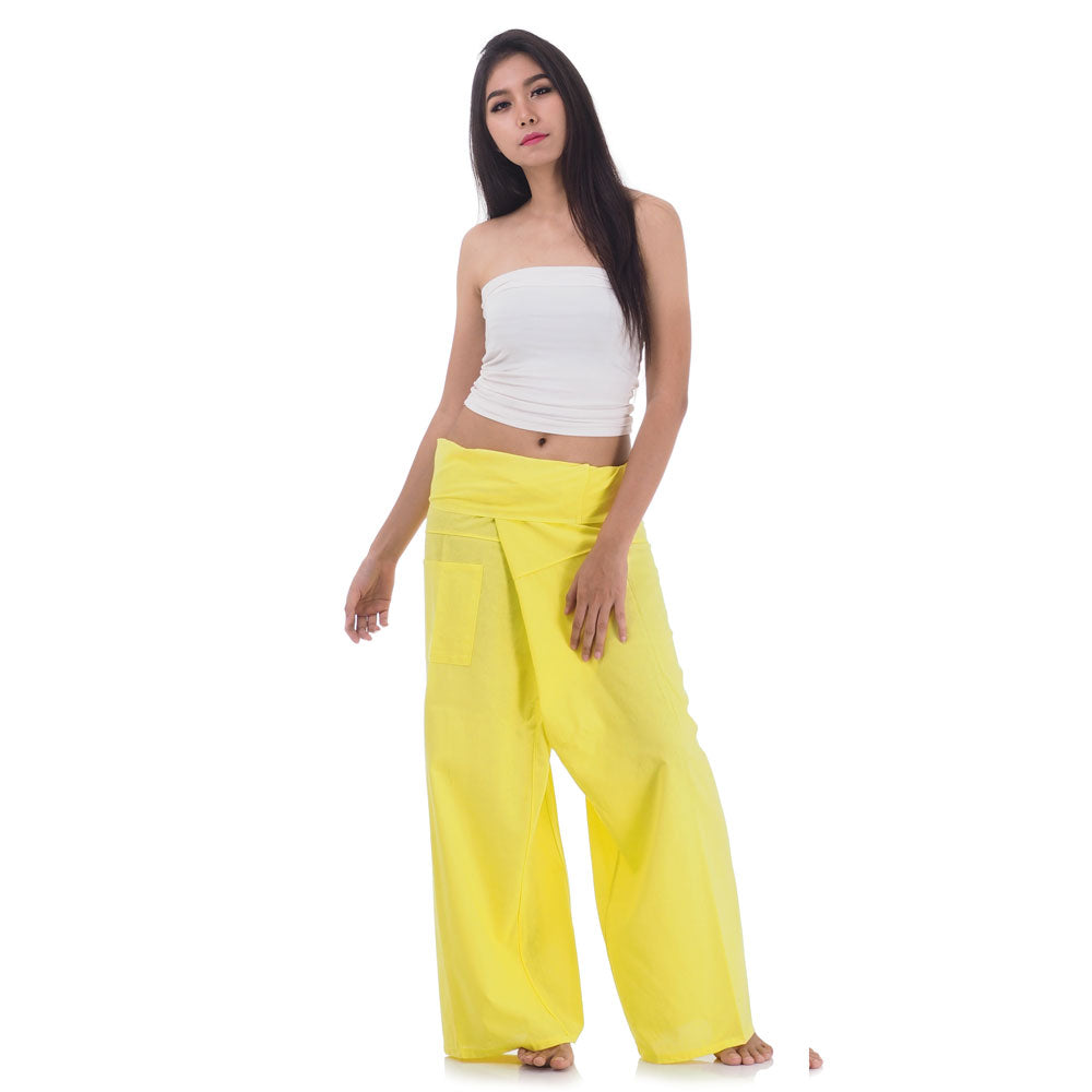 Side profile of a female model showing the relaxed fit and adjustable waistband of Golden Sunshine Thai fisherman pants.