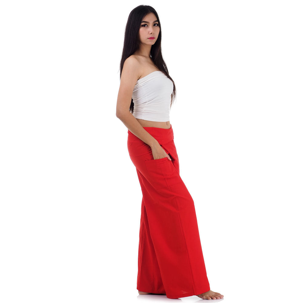 Side profile of a female model showing the relaxed fit and adjustable waistband of Crimson Sunset Thai fisherman pants.