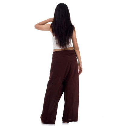 Back view of female model wearing Earthy Brown women's Thai fisherman pants, showcasing the tied waist and flowing fabric.