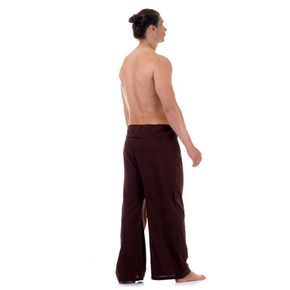 Back view of male model wearing Earthy Brown men's Thai fisherman pants, showcasing the tied waist and flowing fabric.