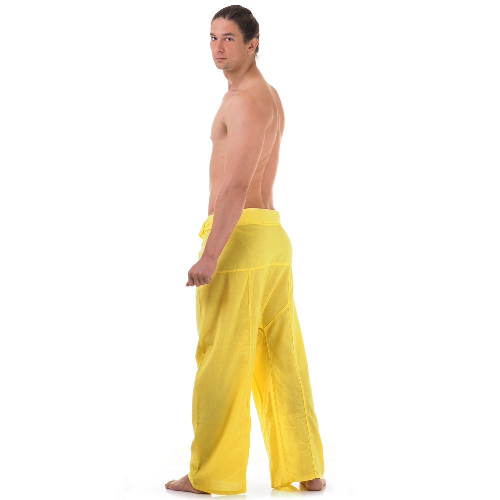 Back view of male model wearing Golden Sunshine men's Thai fisherman pants, showcasing the tied waist and flowing fabric.