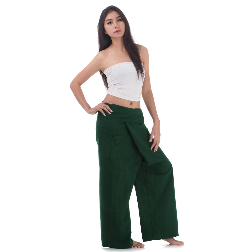 Side profile of a female model showing the relaxed fit and adjustable waistband of Forest Green Oasis Thai fisherman pants.