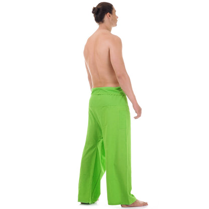 Back view of male model wearing Tropical Lime men's Thai fisherman pants, showcasing the tied waist and flowing fabric.