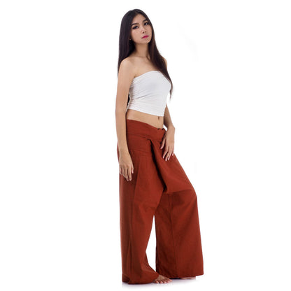 Side profile of a female model showing the relaxed fit and adjustable waistband of Mango Tango Thai fisherman pants.