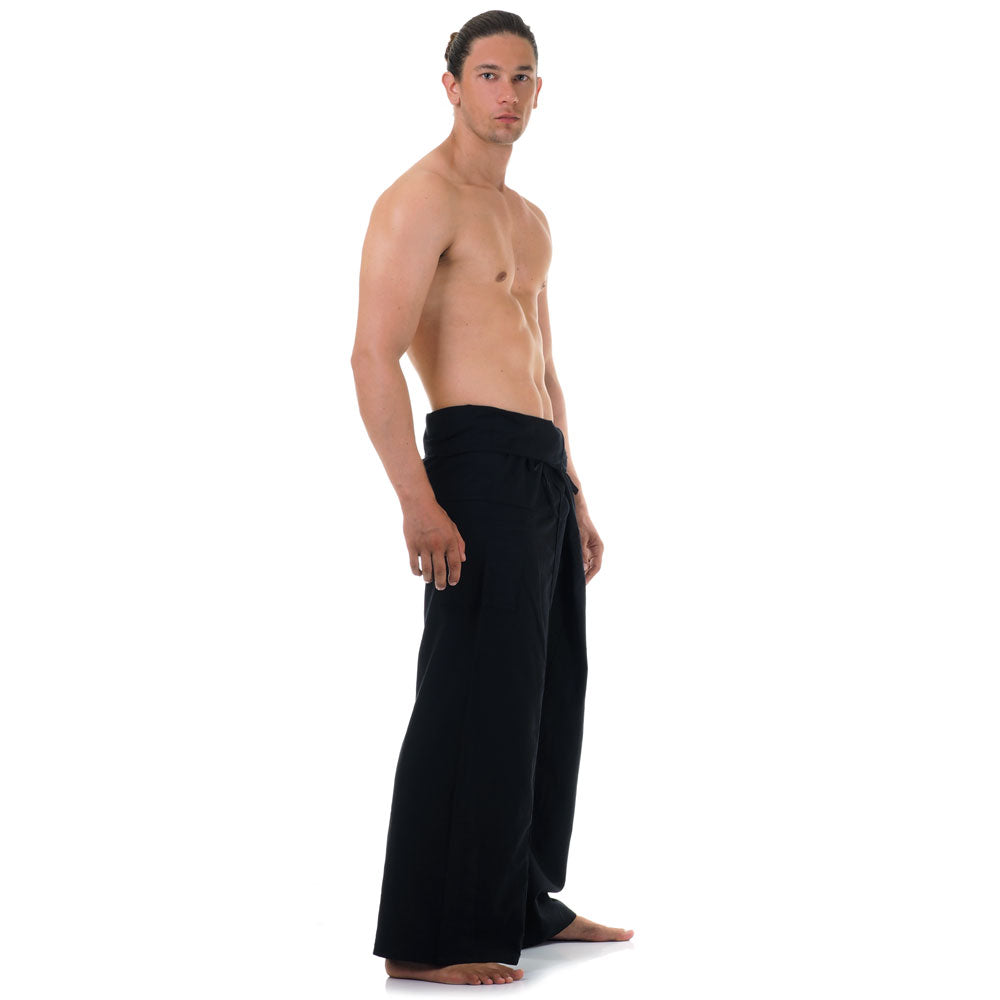 Side profile of a male model showing the relaxed fit and adjustable waistband of Midnight Black Thai fisherman pants.