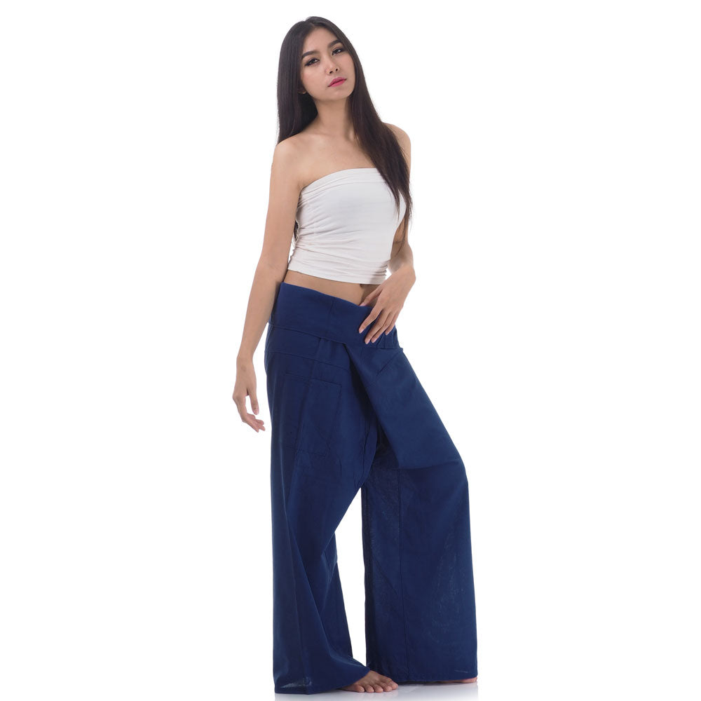 Side profile of a female model showing the relaxed fit and adjustable waistband of Moonlight Blue Thai fisherman pants.