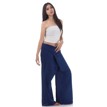Side profile of a female model showing the relaxed fit and adjustable waistband of Moonlight Blue Thai fisherman pants.