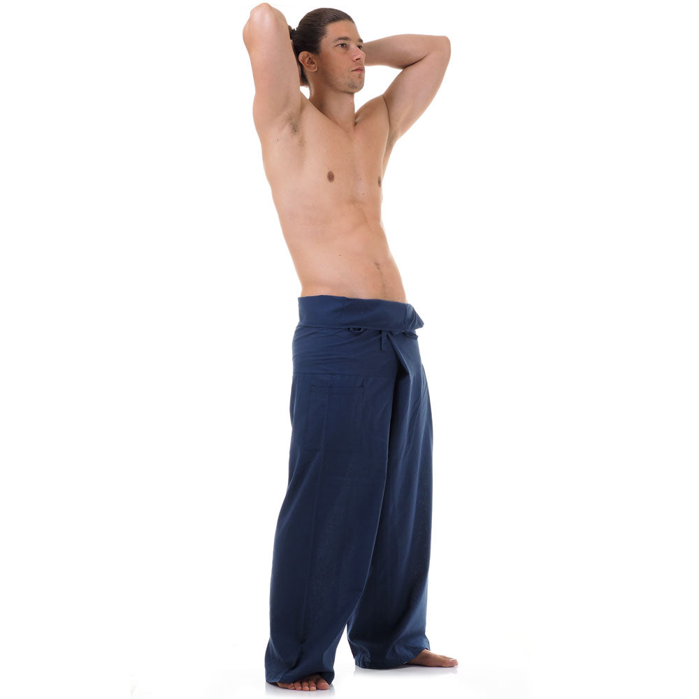 Side profile of a male model showing the relaxed fit and adjustable waistband of Moonlight Blue Thai fisherman pants.