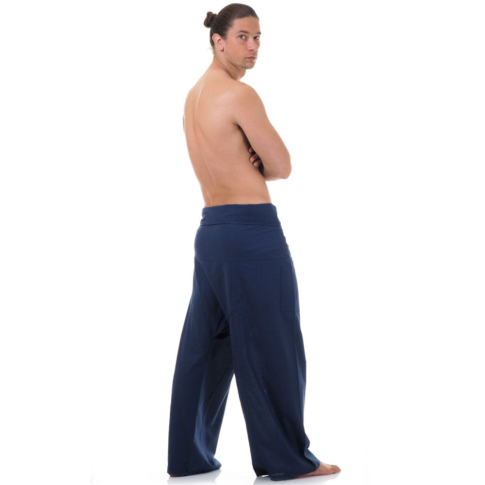 Back view of male model wearing Moonlight Blue men's Thai fisherman pants, showcasing the tied waist and flowing fabric.