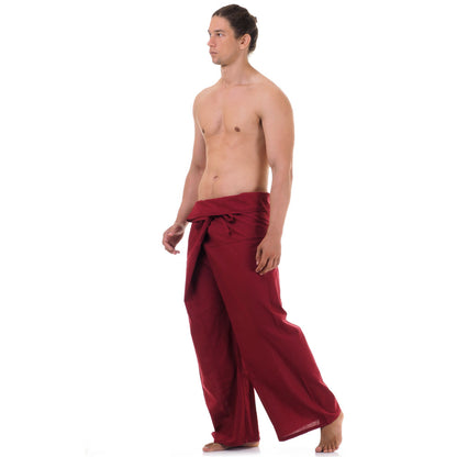 Side profile of a male model showing the relaxed fit and adjustable waistband of Mystic Maroon Thai fisherman pants.