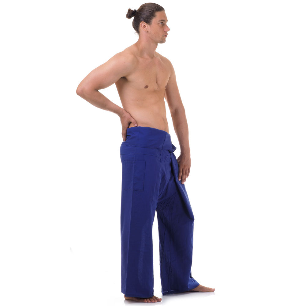 Side profile of a male model showing the relaxed fit and adjustable waistband of Oceanic Navy Thai fisherman pants.