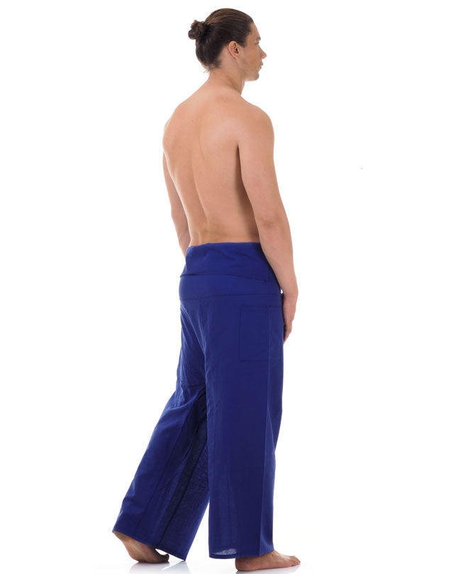 Back view of male model wearing Oceanic Navy men's Thai fisherman pants, showcasing the tied waist and flowing fabric.