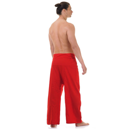 Back view of male model wearing Crimson Sunset men's Thai fisherman pants, showcasing the tied waist and flowing fabric.