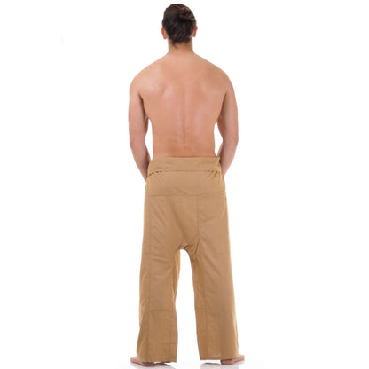 Back view of male model wearing Sandy Beige men's Thai fisherman pants, showcasing the tied waist and flowing fabric.