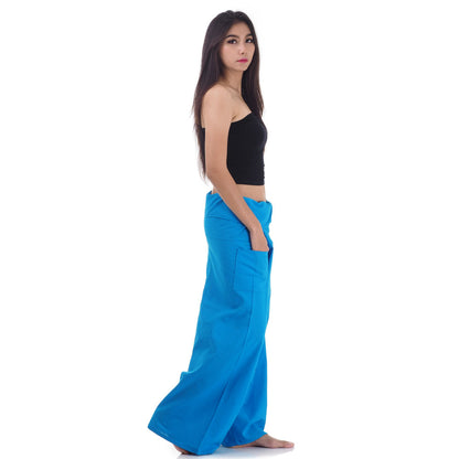 Side profile of a female model showing the relaxed fit and adjustable waistband of Sky Blue Horizon Thai fisherman pants.