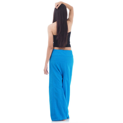 Back view of female model wearing Sky Blue Horizon women's Thai fisherman pants, showcasing the tied waist and flowing fabric.