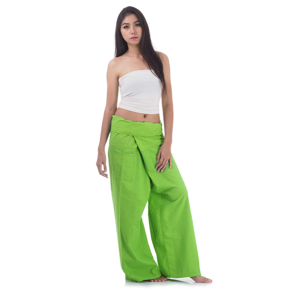 Side profile of a female model showing the relaxed fit and adjustable waistband of Tropical Lime Thai fisherman pants.