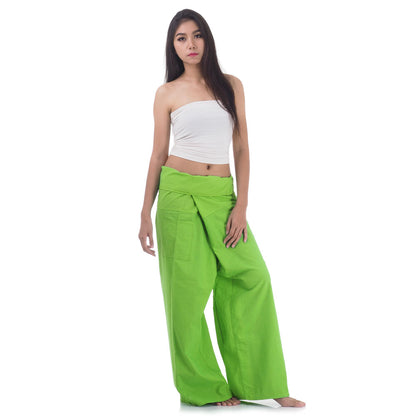 Side profile of a female model showing the relaxed fit and adjustable waistband of Tropical Lime Thai fisherman pants.