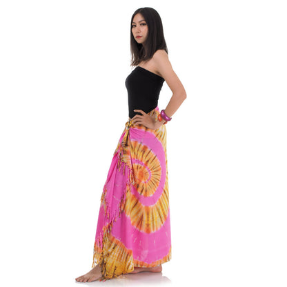 Side view of the pink batik wrap skirt showing the various wrapping possibilities of the pareo.