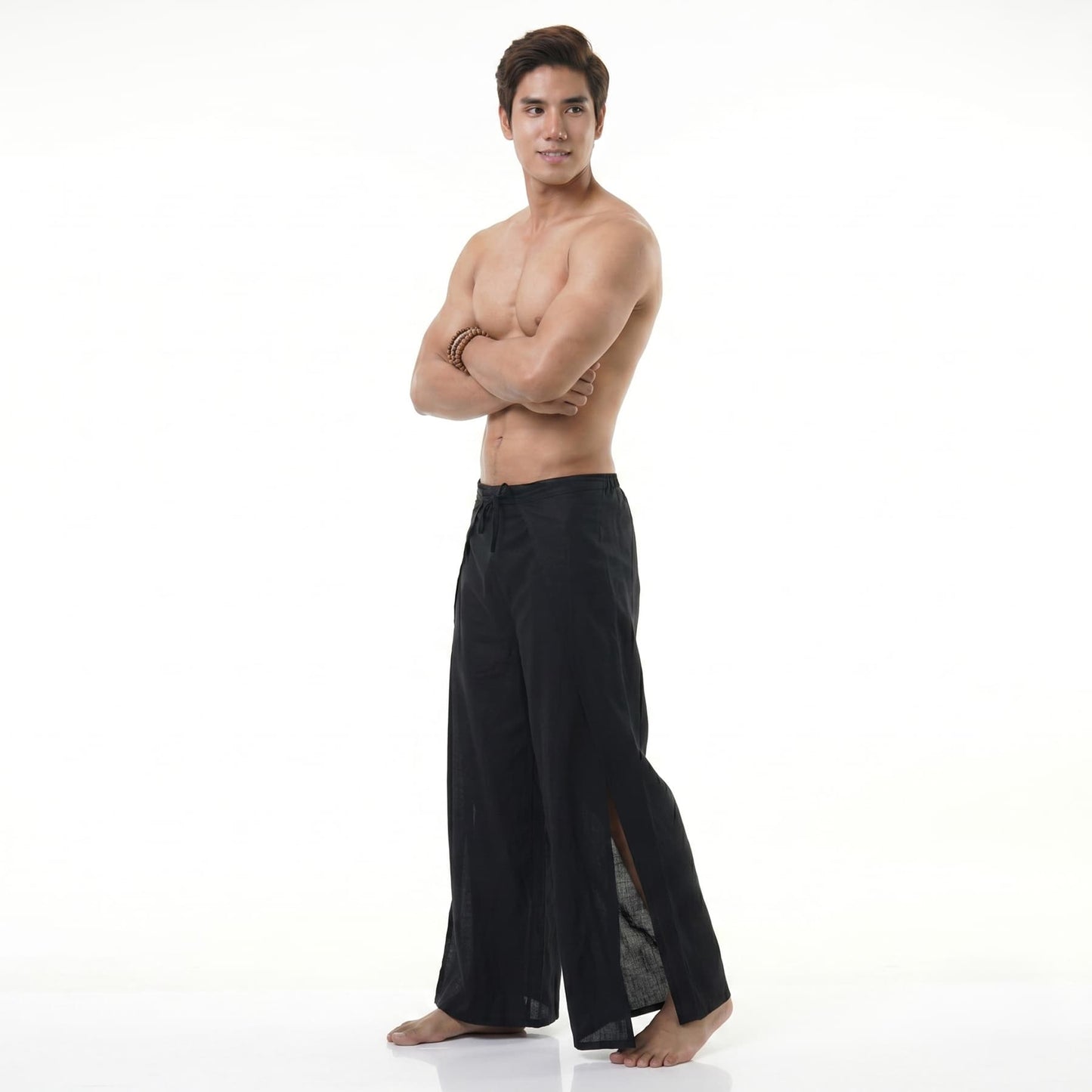 Side view of the black wrap pants for men, highlighting the lightweight and flexible folding design.