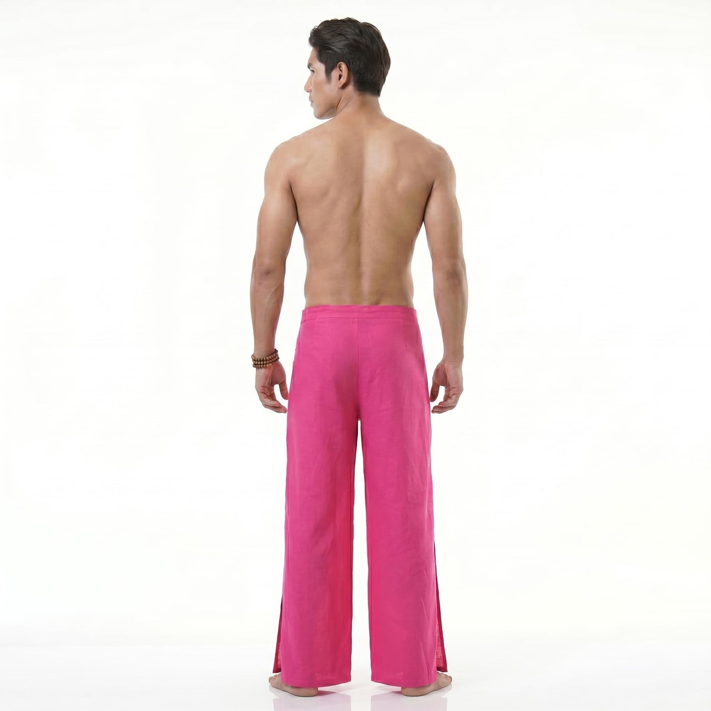Rear view of the pink Men's Thai wrap pants, emphasizing the loose-fitting holiday style.