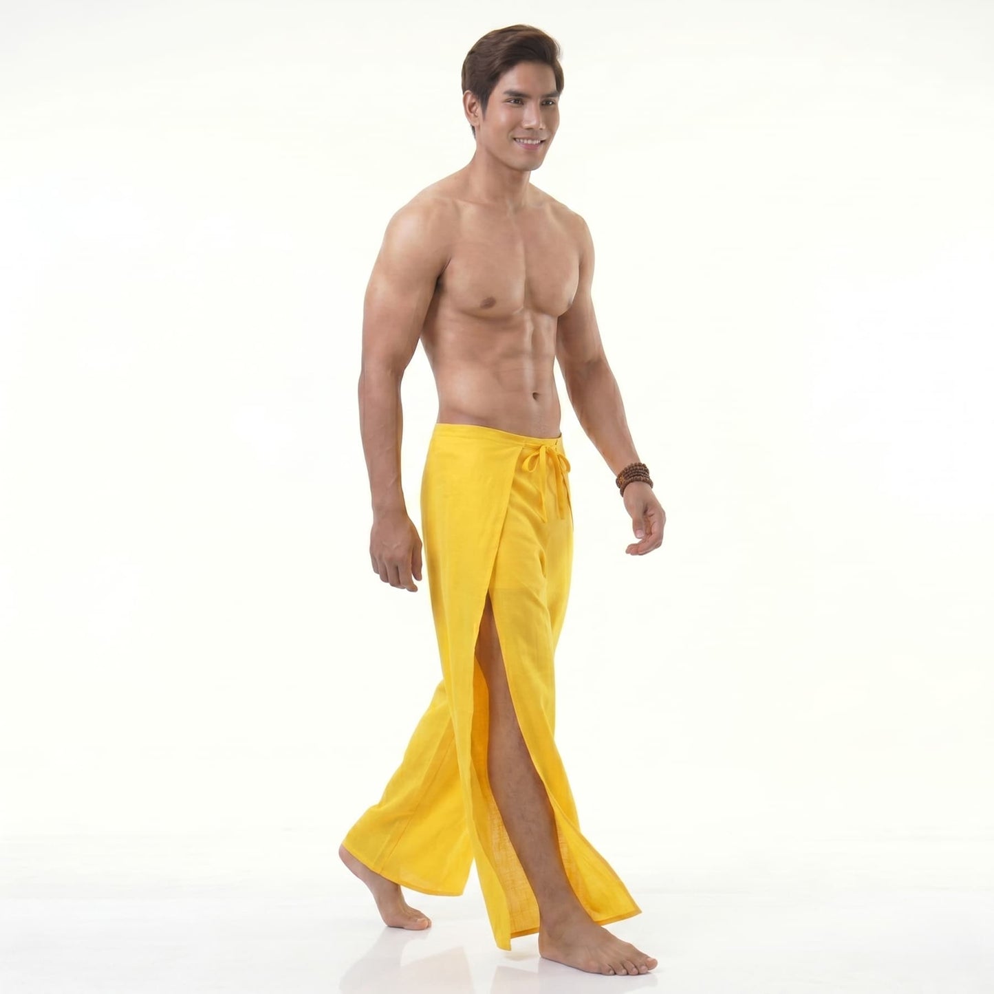 Side profile of the yellow wrap pants for men, showcasing the comfortable loose fit.