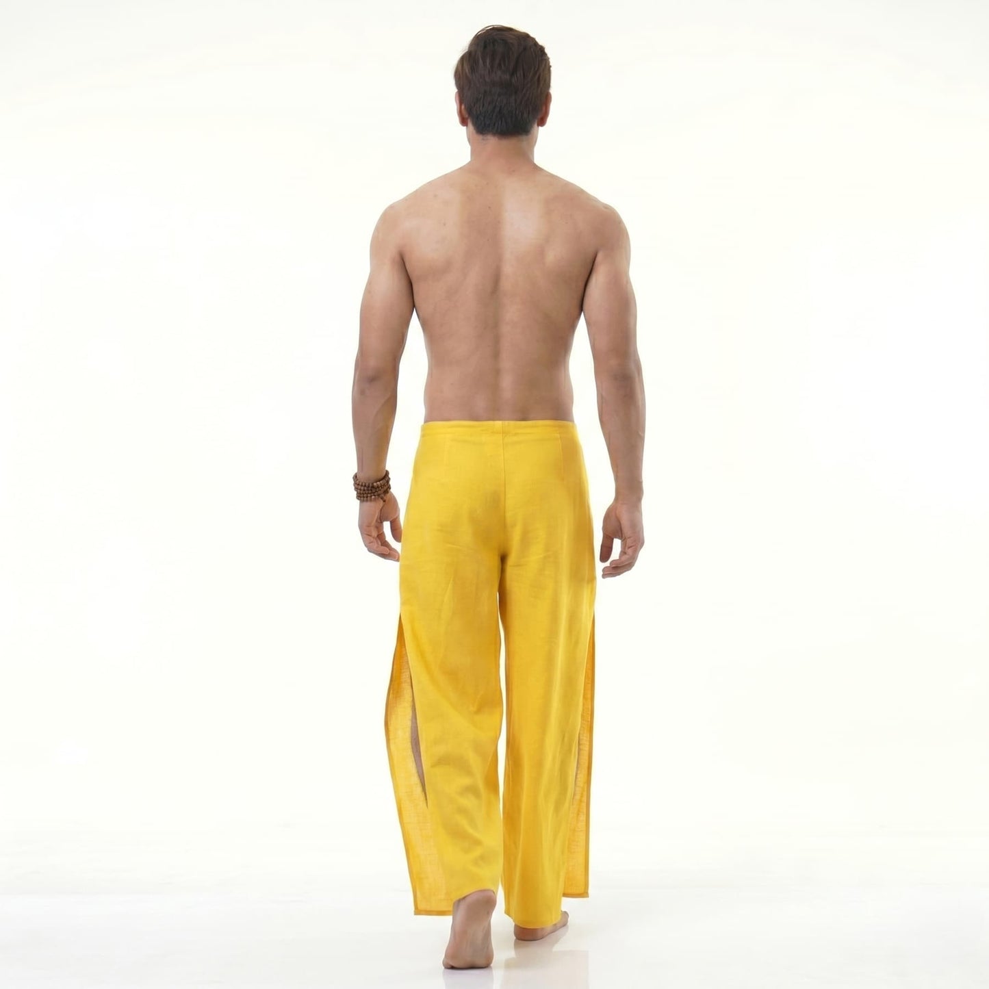 Rear view of the yellow Men's Thai wrap pants, emphasizing the breezy design for hot weather.