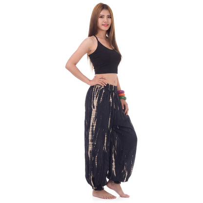 Side profile of the Midnight Black Women's Tie Dye Harem Pants, highlighting the loose silhouette and gathered elastic cuffs.