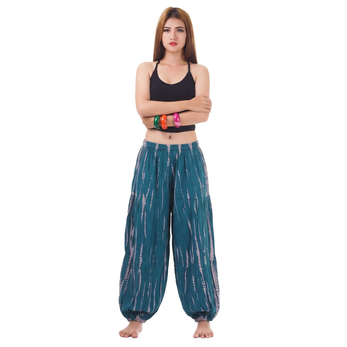 Front view of the Women's Tie Dye Harem Pants Ocean Breeze on a female model, showing the flowy fit and flexible smocked waist.