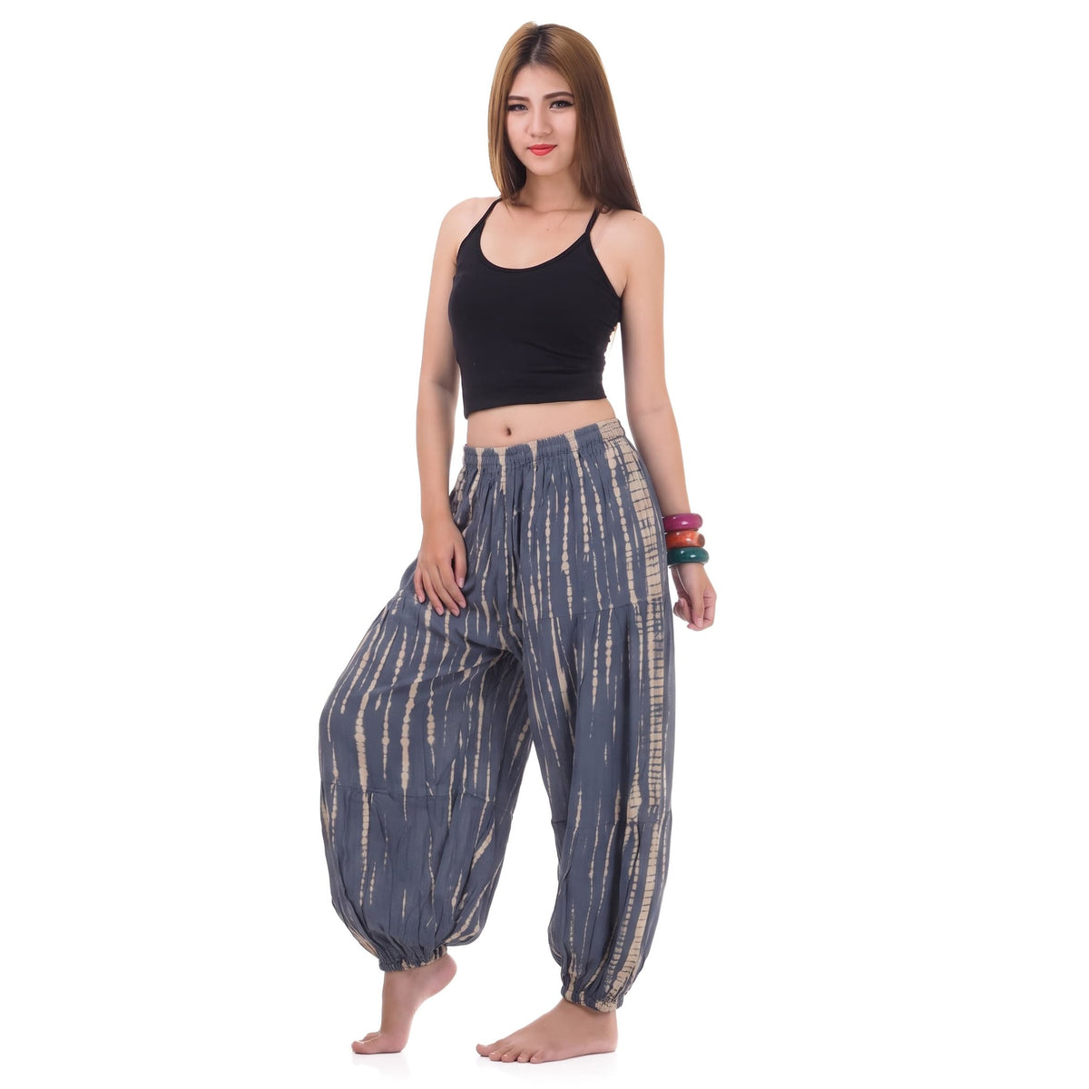 Side profile of the Women's Tie Dye Harem Pants Misty Gray, showing the relaxed fit and elastic ankle cuffs.