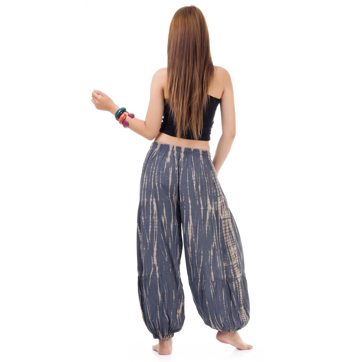 Rear view of the Women's Tie Dye Harem Pants Misty Gray on a female model, demonstrating the casual and breezy silhouette.