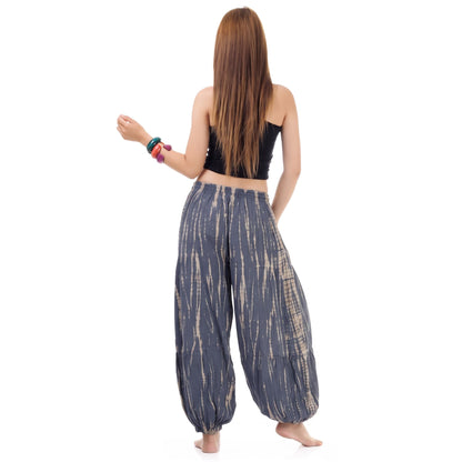Rear view of the Women's Tie Dye Harem Pants Misty Gray on a female model, demonstrating the casual and breezy silhouette.