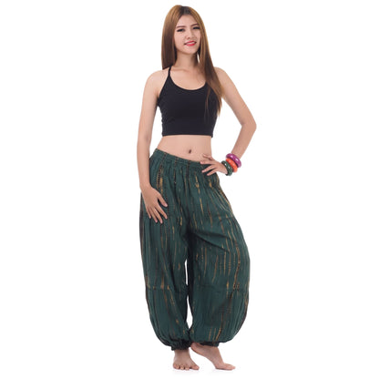 Front view of the Women's Tie Dye Harem Pants Tropical Adventure on a female model, showcasing the relaxed boho cut.