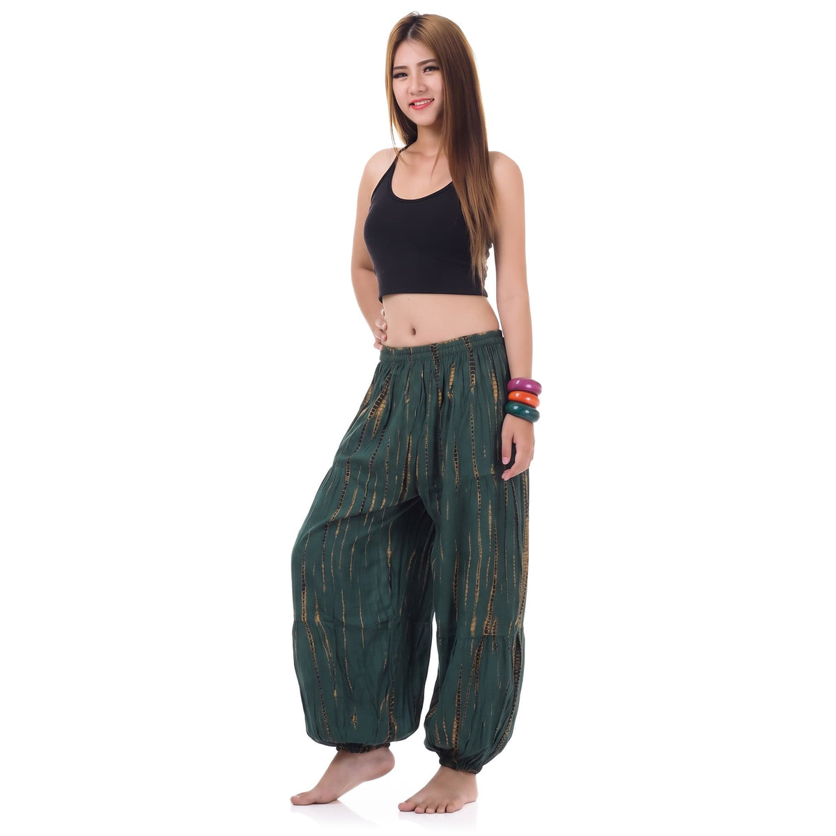 Side profile of the Women's Tie Dye Harem Pants Tropical Adventure, illustrating the wide-leg drape and ankle gathers.