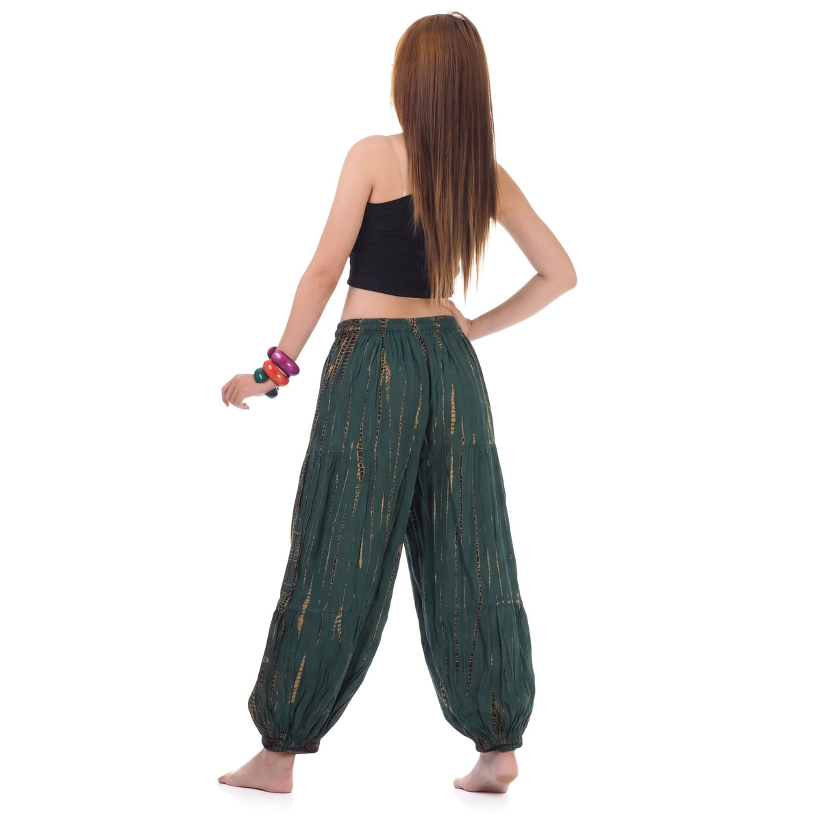 Rear view of the Women's Tie Dye Harem Pants Tropical Adventure on a female model, emphasizing comfort and mobility.