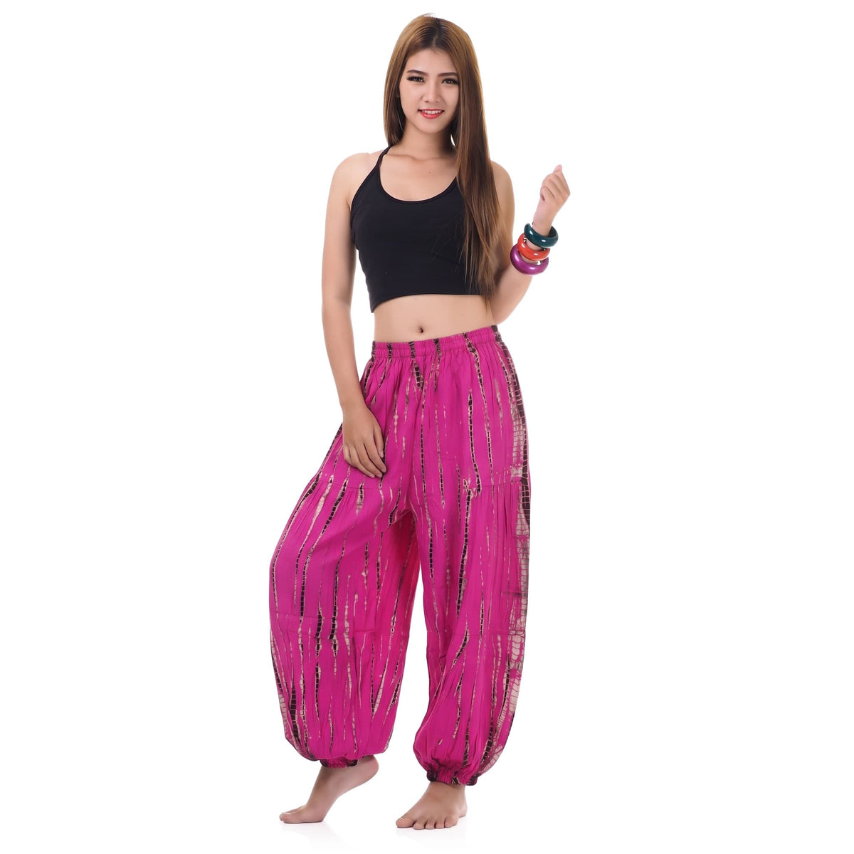 Front view of the Tie Dye Women's Harem Pants Lotus Bloom on a female model, featuring a stretchy high-rise waistband.