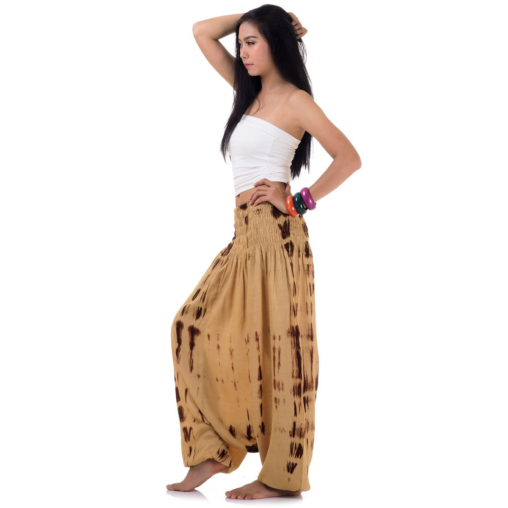 Side profile of beige tie dye pants showing the wide-leg jumper style.